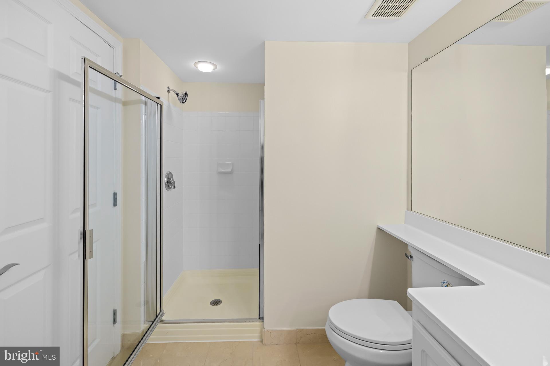 11710 Old Georgetown Road, Unit 1116W North Bethesda, MD 20852 - Photo 24 of 52 a bathroom with a toilet a sink and shower