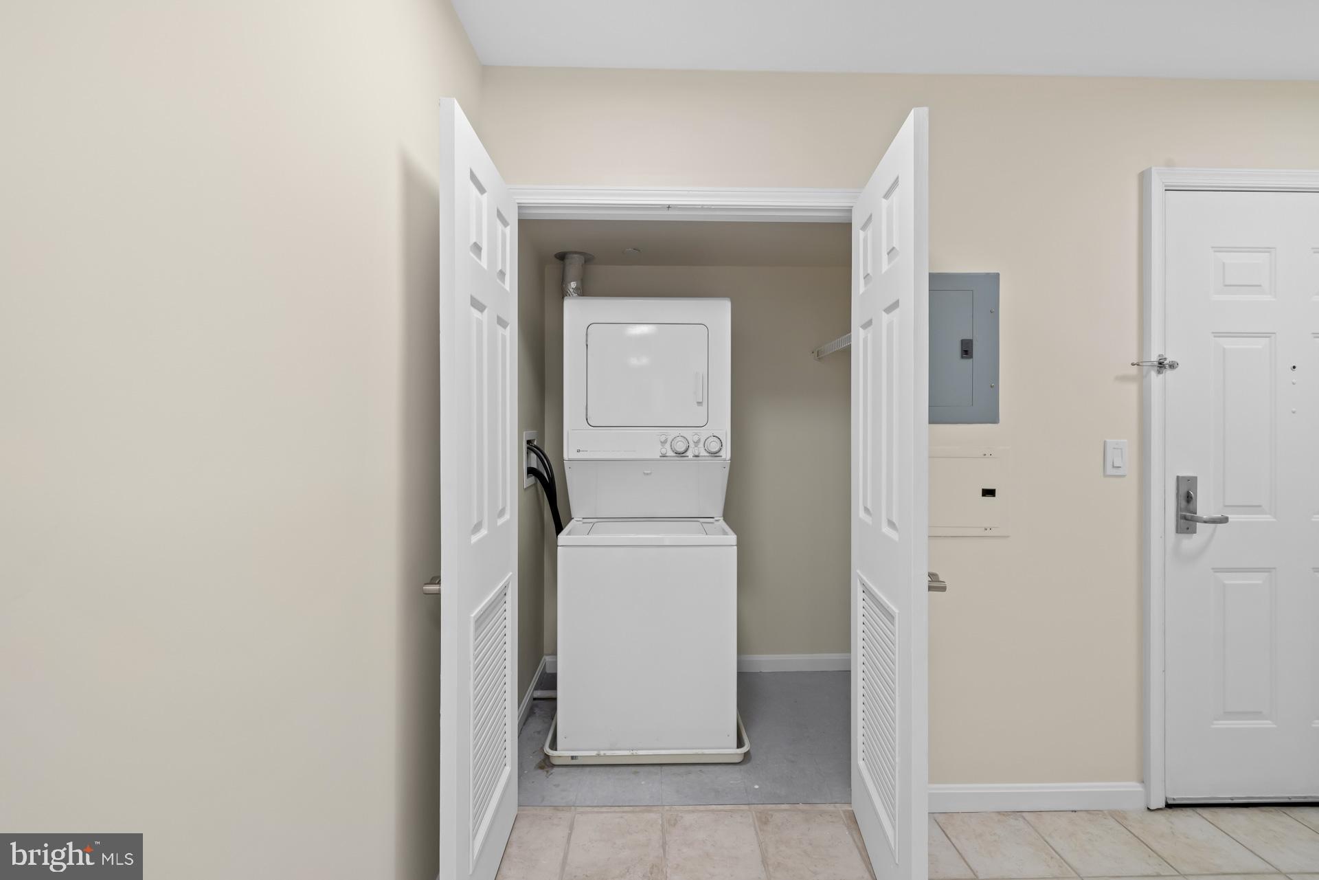 11710 Old Georgetown Road, Unit 1116W North Bethesda, MD 20852 - Photo 25 of 52 a utility room with a washer and dryer