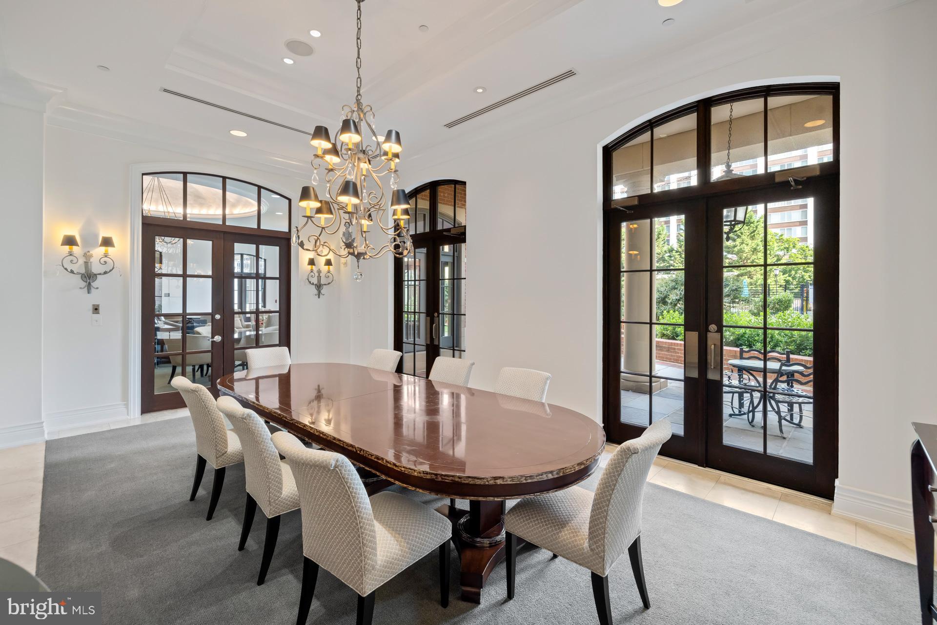 11710 Old Georgetown Road, Unit 1116W North Bethesda, MD 20852 - Photo 38 of 52 a dining room with furniture a chandelier and wooden floor