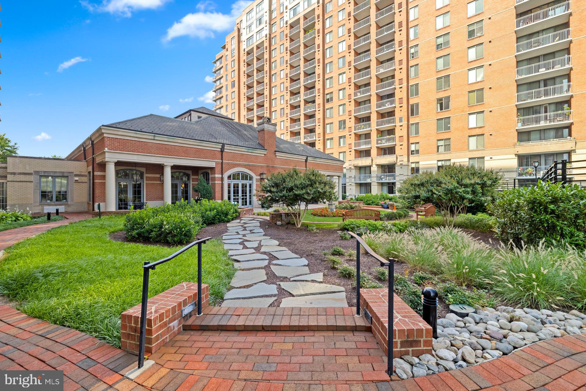 11710 Old Georgetown Road, Unit 1116W North Bethesda, MD 20852 - Photo 45 of 52 a front view of a building with garden and seating area