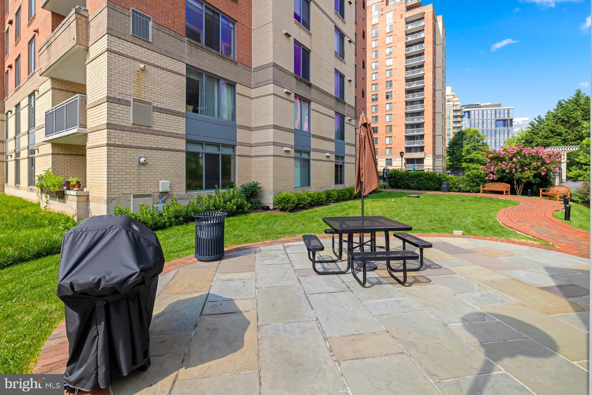 11710 Old Georgetown Road, Unit 1116W North Bethesda, MD 20852 - Photo 50 of 52 a view of a brick wall with a chairs in a patio