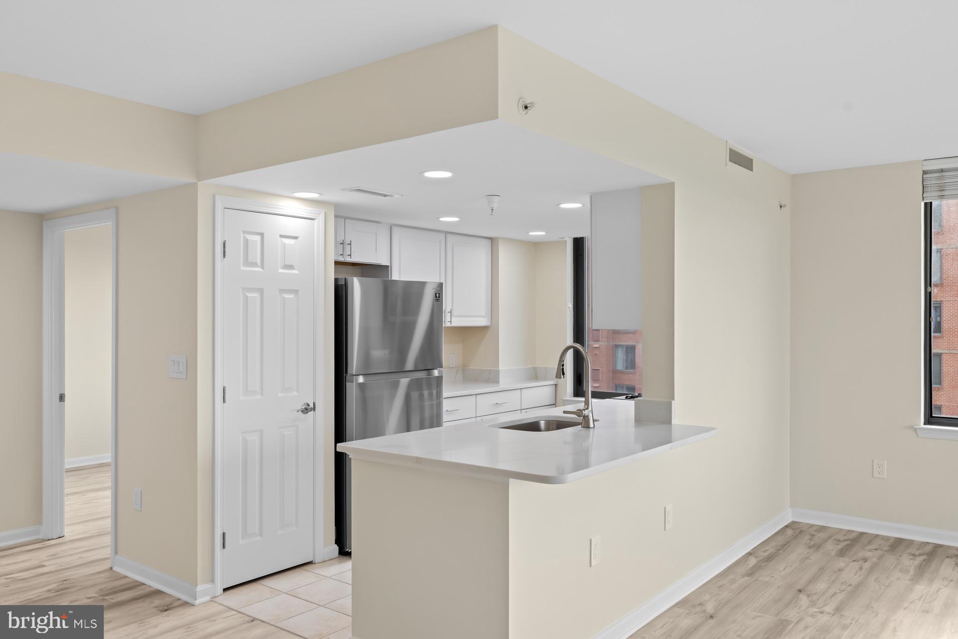11710 Old Georgetown Road, Unit 1116W North Bethesda, MD 20852 - Photo 5 of 52 a kitchen with refrigerator and a sink