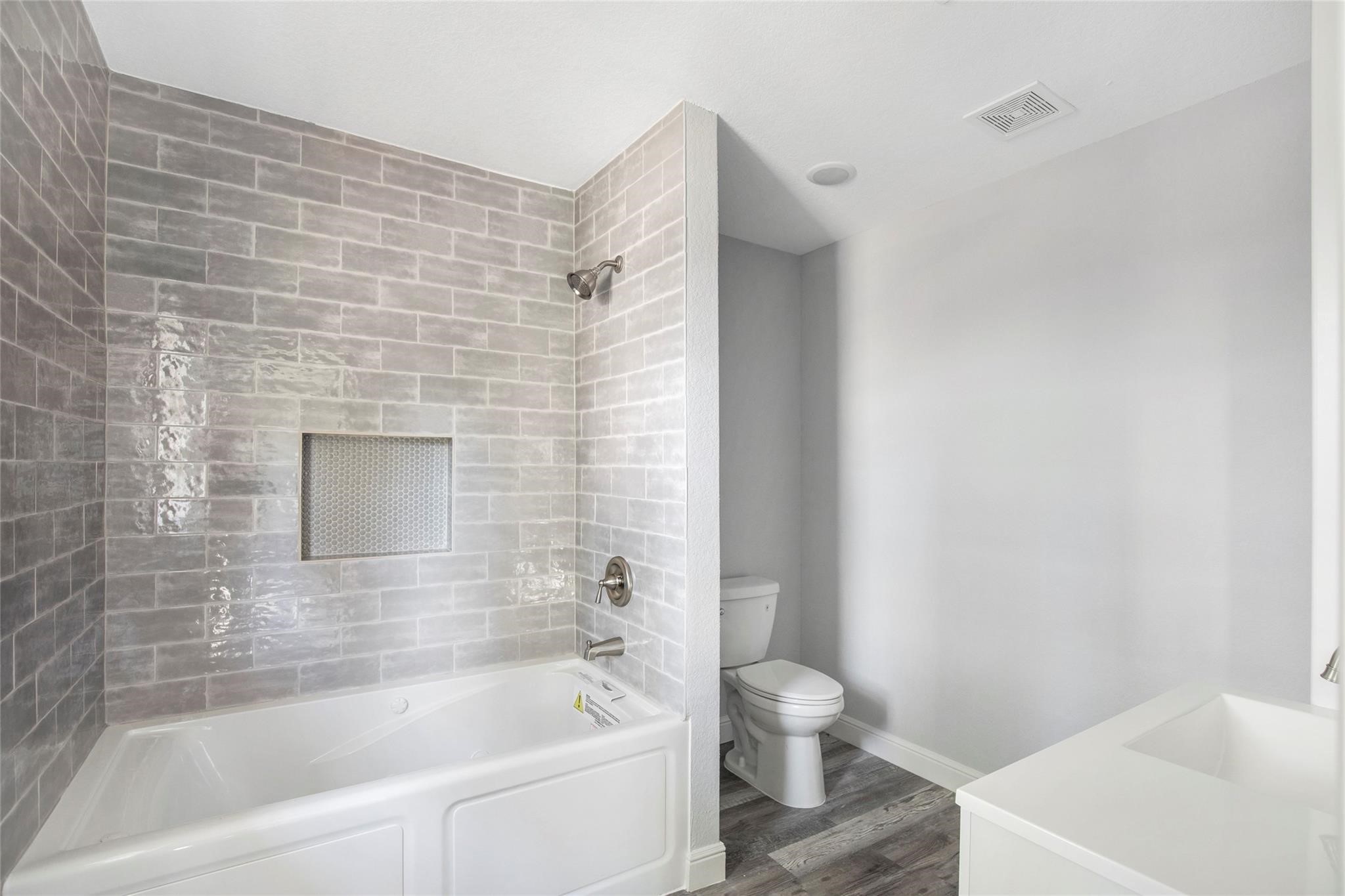 1 Mill Creek Road Point Blank, TX 77364 - Photo 23 of 43 a bathroom with a bathtub and a toilet