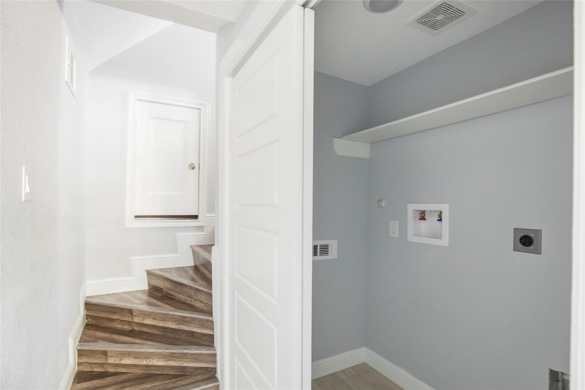 1 Mill Creek Road Point Blank, TX 77364 - Photo 42 of 43 a view of a hallway with wooden floor and a bathroom