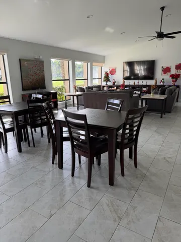 a view of a dining room with furniture