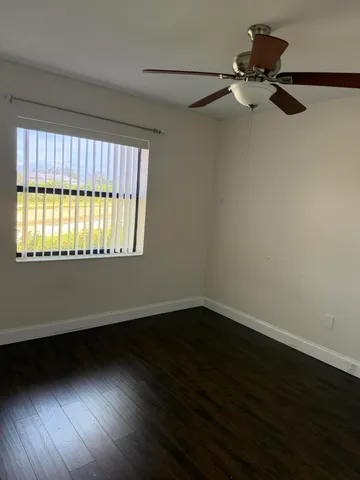 a view of an empty room and a window