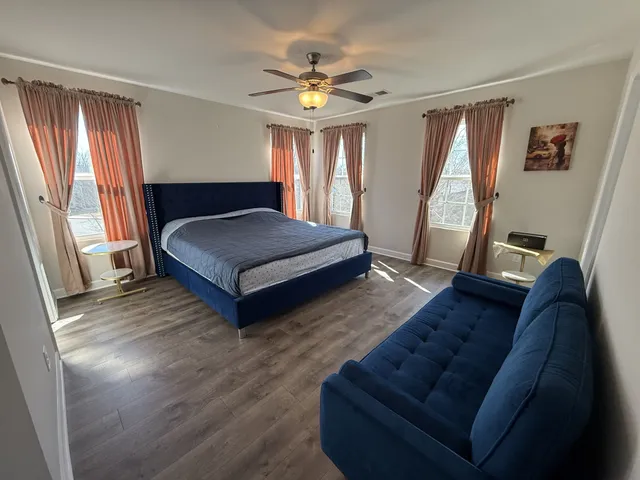 a living room with furniture and a large window