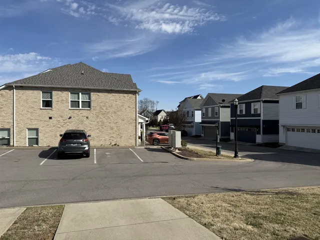 a view of a car parked in front of a house