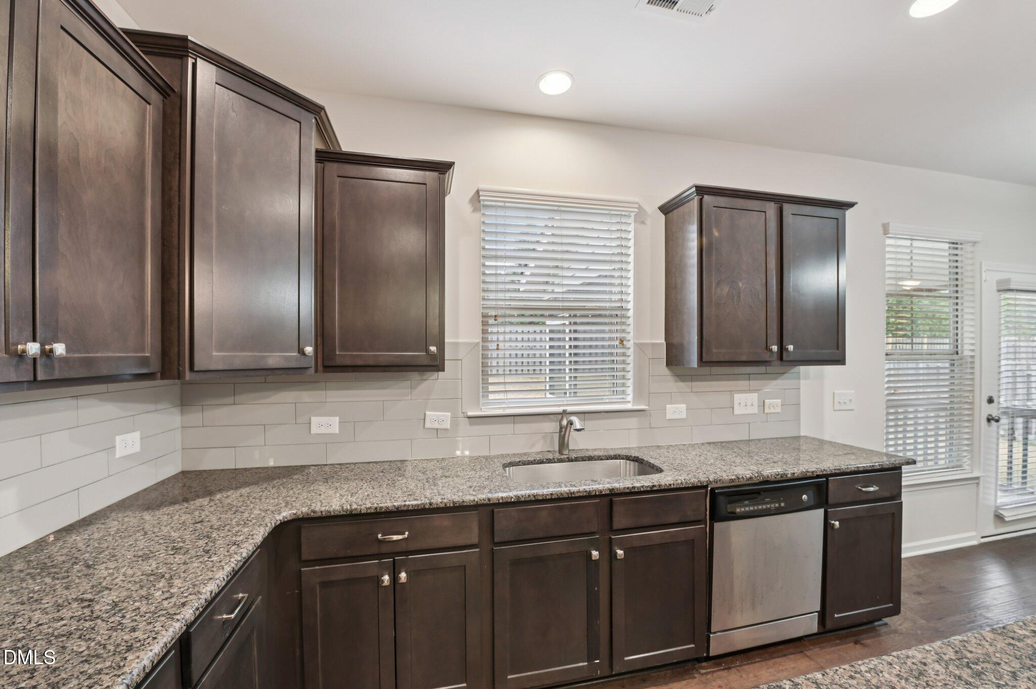 1024 Laredo Lane Durham, NC 27703 - Photo 13 of 32 a bathroom with double sink and a large mirror