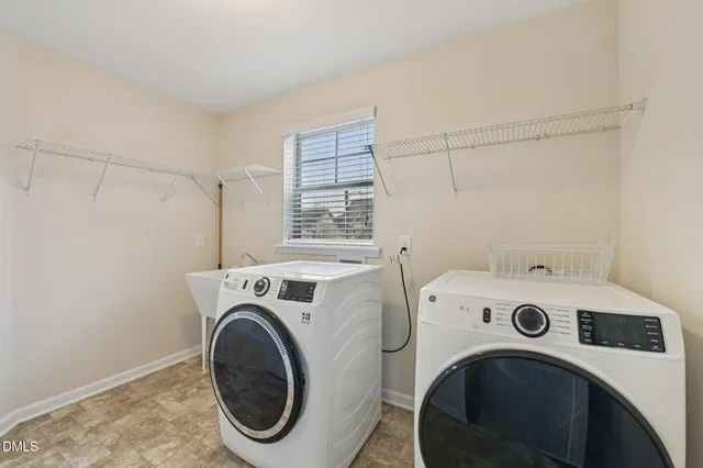 a utility room with dryer and washer