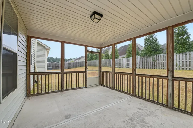 a view of a porch with wooden floor