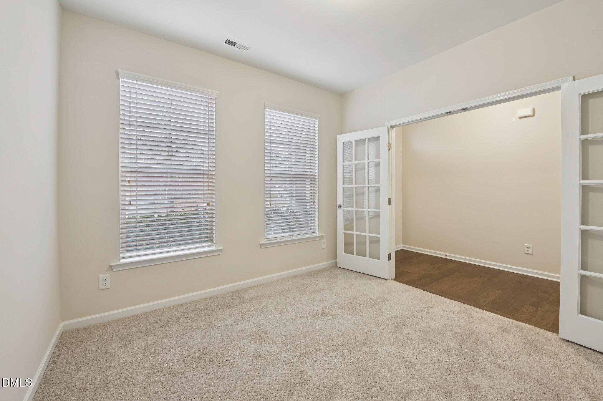 1024 Laredo Lane Durham, NC 27703 - Photo 4 of 32 an empty room with windows