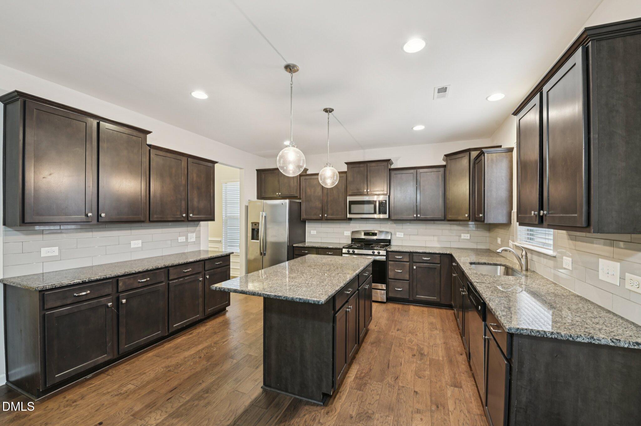 1024 Laredo Lane Durham, NC 27703 - Photo 9 of 32 a large kitchen with granite countertop lots of counter top space