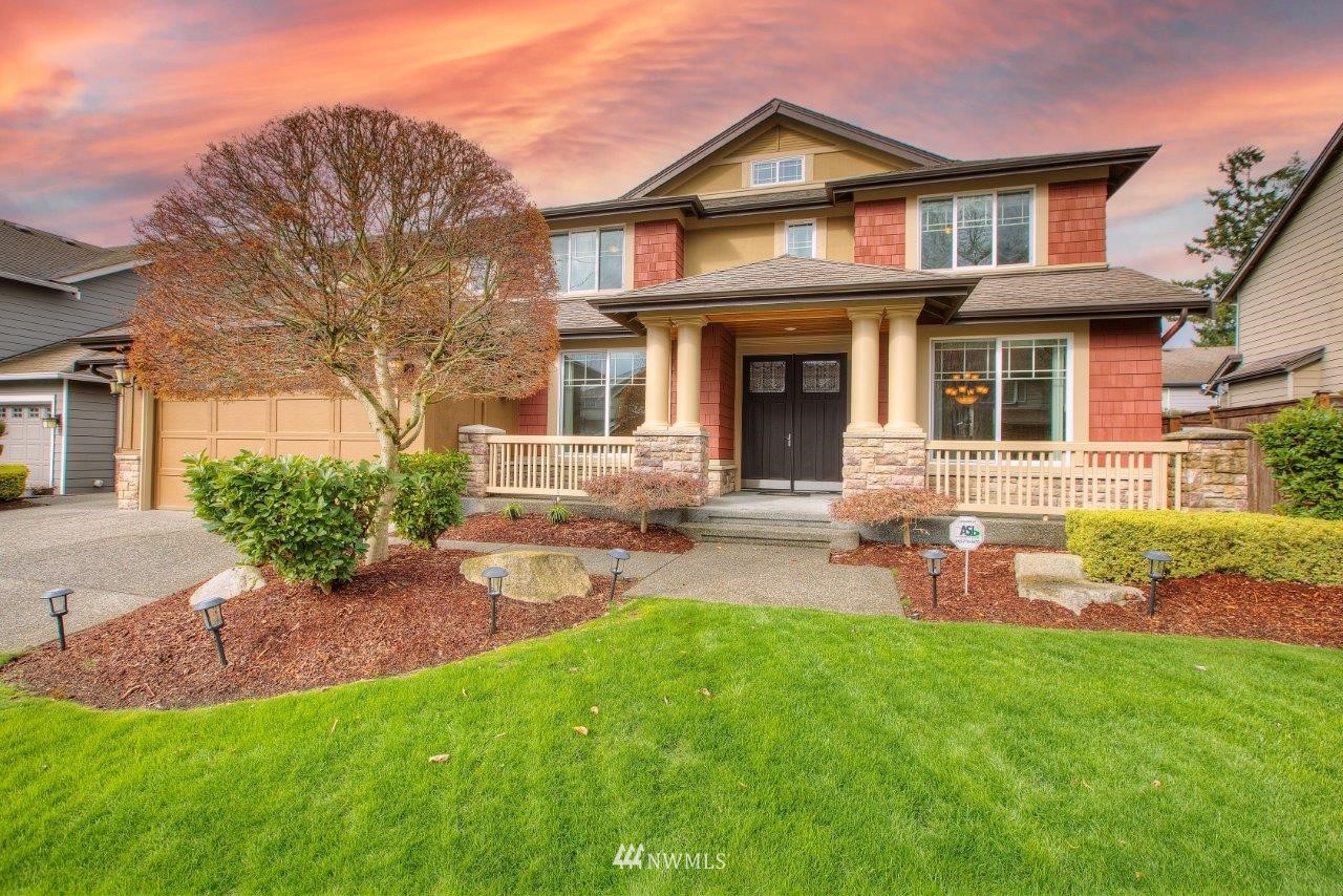 front view of a house with a yard
