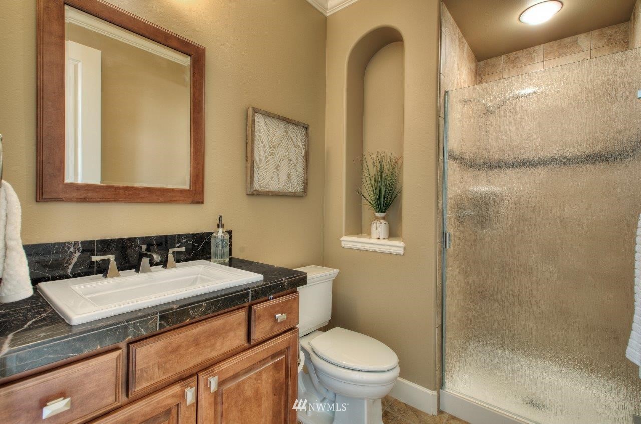 123 Ilwaco Place Southeast Renton, WA 98059 - Photo 15 of 33 a bathroom with a sink toilet and shower