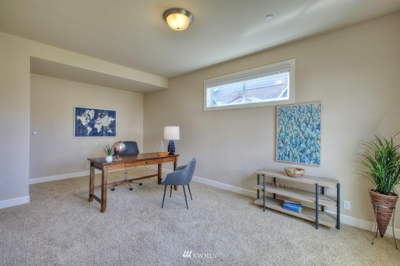 123 Ilwaco Place Southeast Renton, WA 98059 - Photo 16 of 33 a view of a livingroom with furniture and a couch