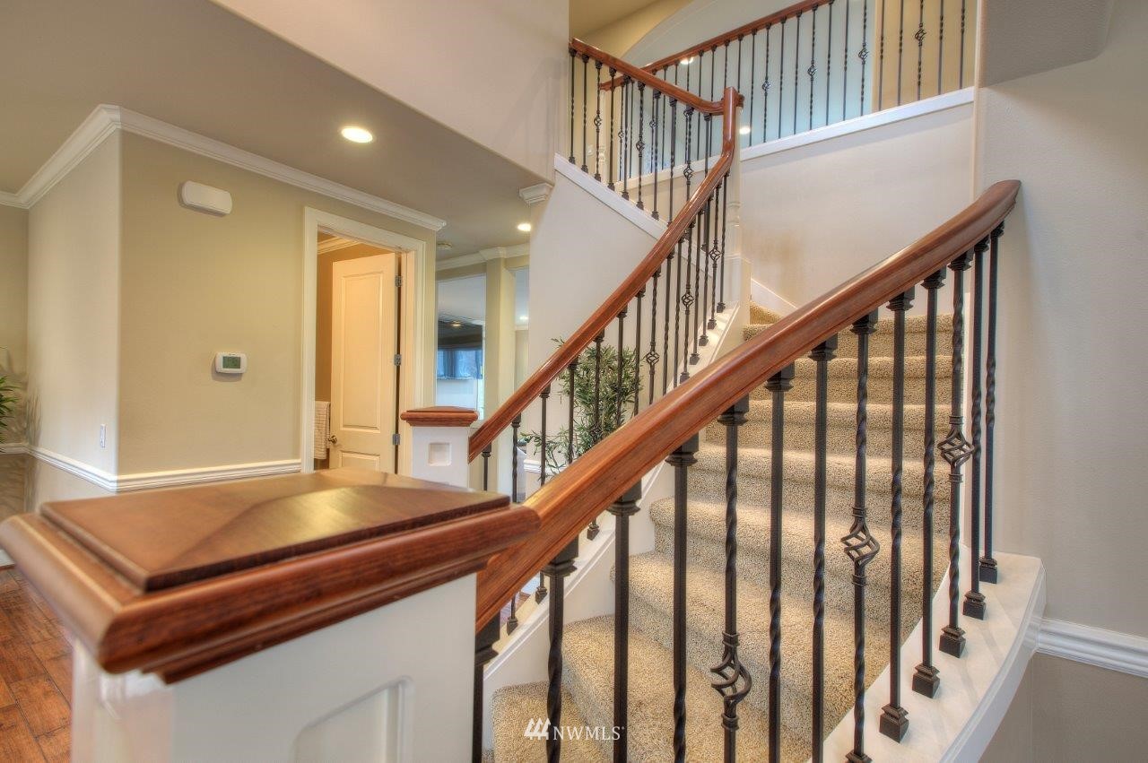 123 Ilwaco Place Southeast Renton, WA 98059 - Photo 17 of 33 a view of entryway with wooden floor and stairs