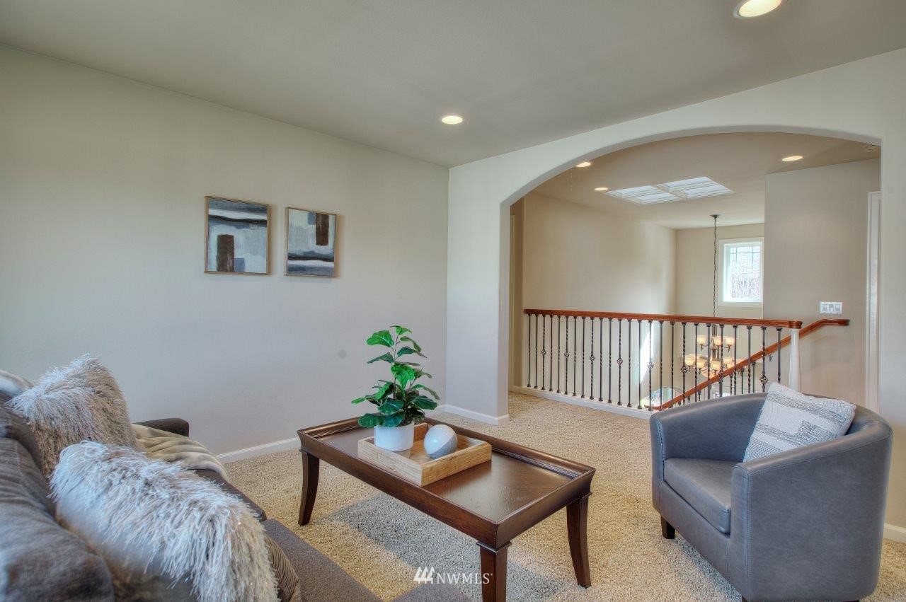123 Ilwaco Place Southeast Renton, WA 98059 - Photo 19 of 33 a living room with furniture and a potted plant