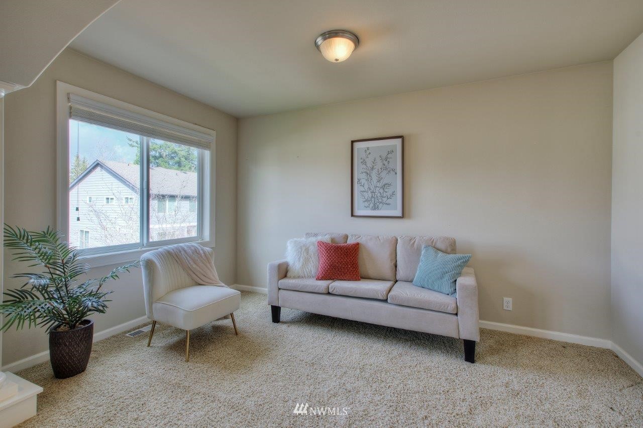 123 Ilwaco Place Southeast Renton, WA 98059 - Photo 22 of 33 a living room with furniture and a potted plant