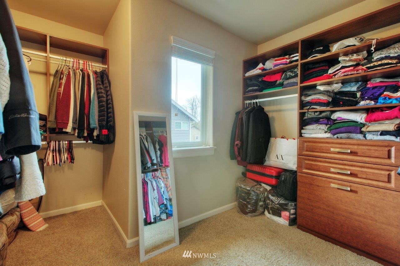 123 Ilwaco Place Southeast Renton, WA 98059 - Photo 25 of 33 a view of walk in closet with clothes and shoes