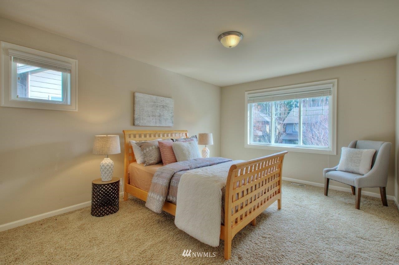 123 Ilwaco Place Southeast Renton, WA 98059 - Photo 26 of 33 a bedroom with a bed and a window