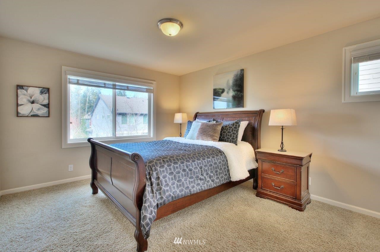 123 Ilwaco Place Southeast Renton, WA 98059 - Photo 29 of 33 a bedroom with a bed and window