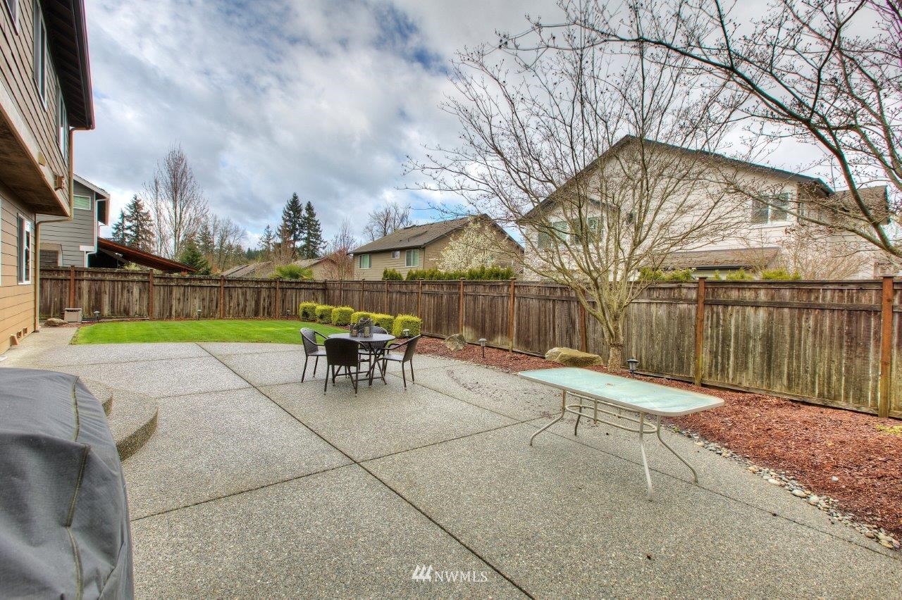 123 Ilwaco Place Southeast Renton, WA 98059 - Photo 31 of 33 a view of a backyard with a table and chairs