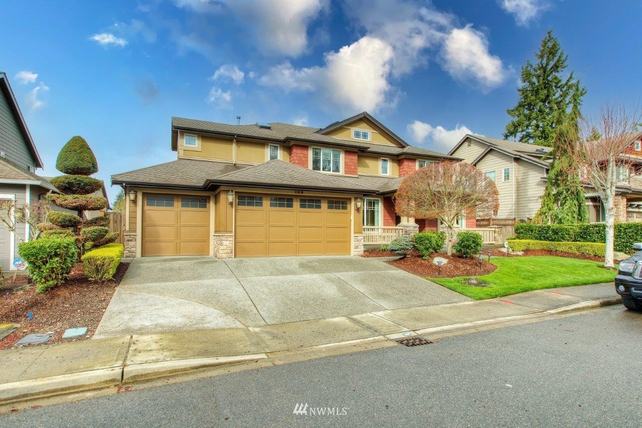 123 Ilwaco Place Southeast Renton, WA 98059 - Photo 33 of 33 a front view of a house with garden