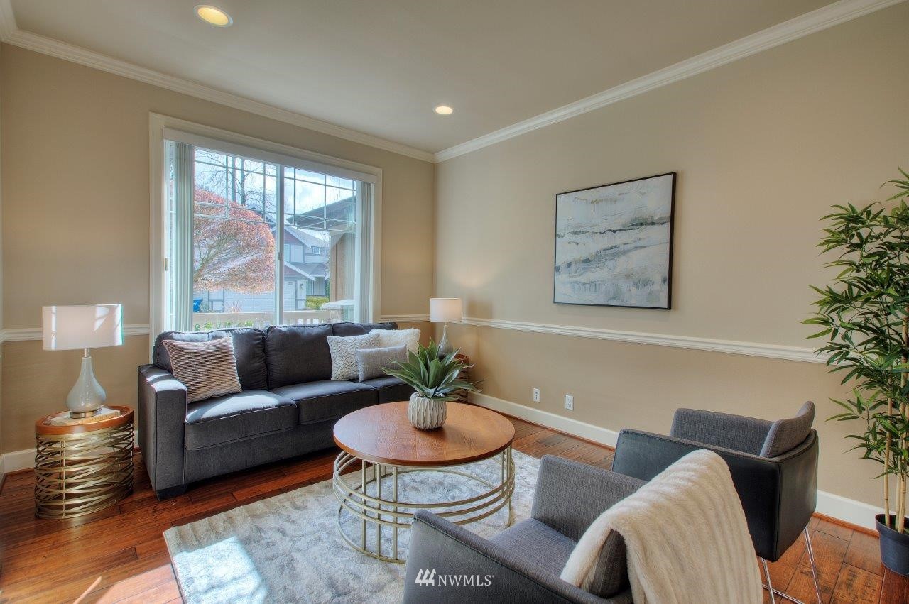 123 Ilwaco Place Southeast Renton, WA 98059 - Photo 5 of 33 a living room with furniture and a large window