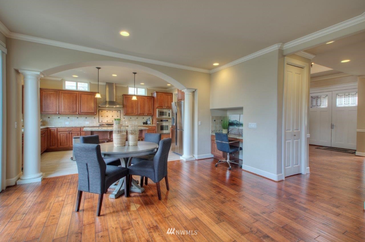 123 Ilwaco Place Southeast Renton, WA 98059 - Photo 8 of 33 a dining room with furniture and wooden floor