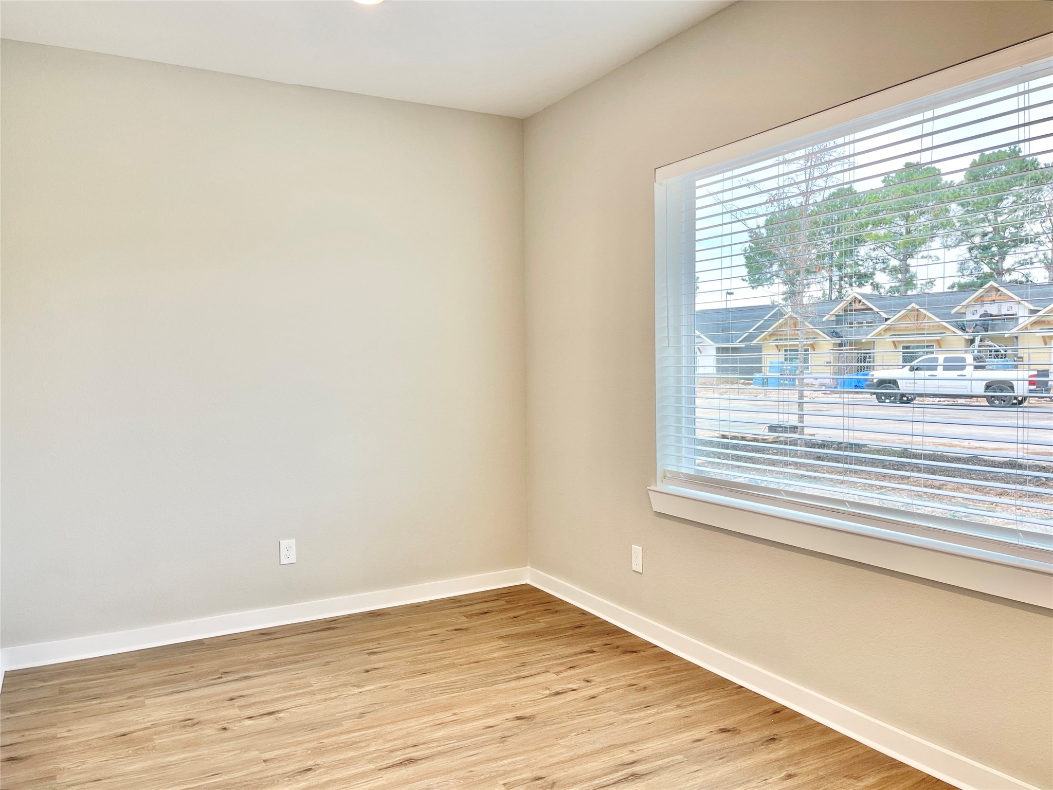 10317 Lake Road, Unit 4A Houston, TX 77070 - Photo 5 of 14 a view of a room with wooden floor and a window