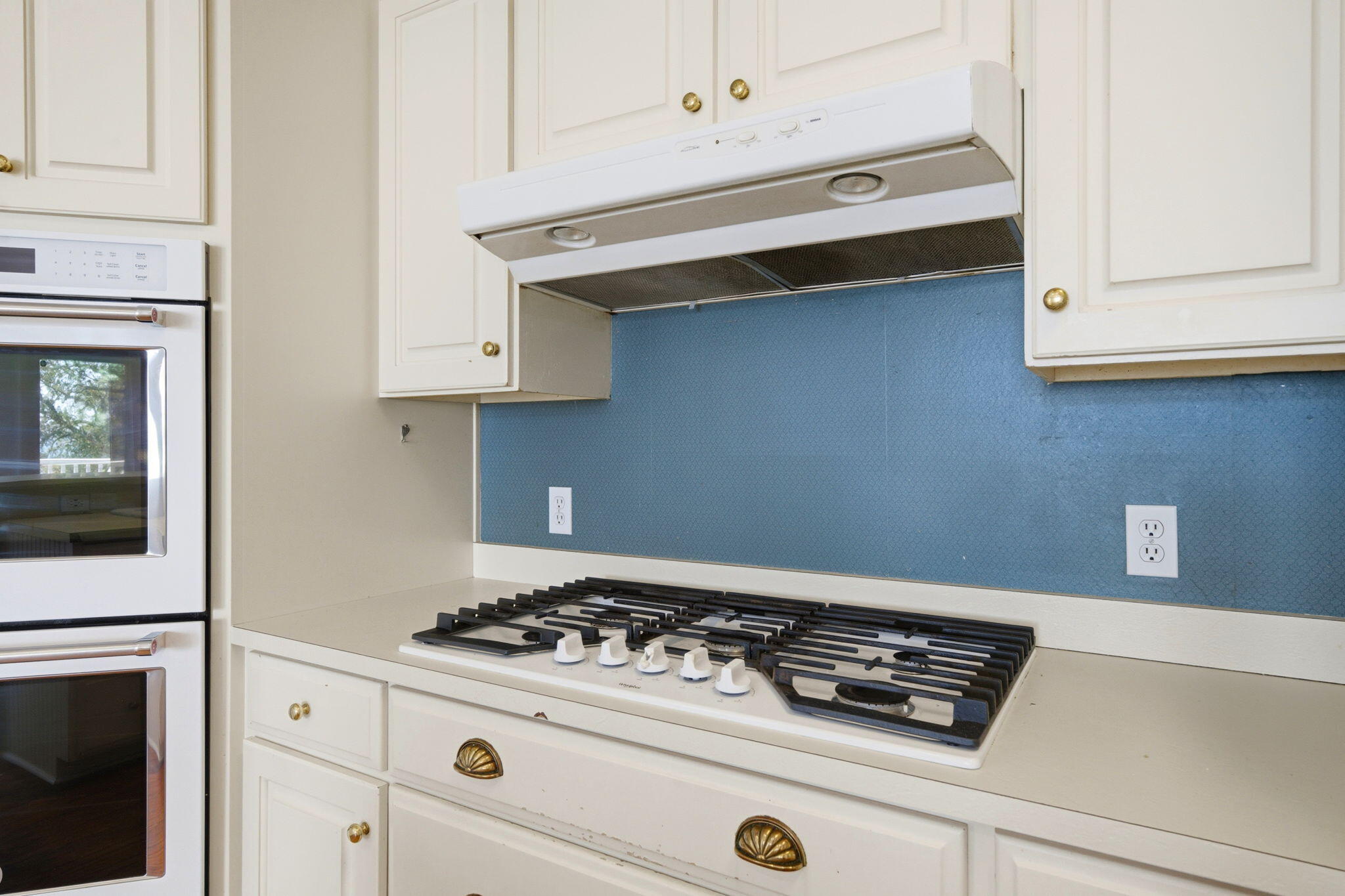 8127 Pompano Street Navarre, FL 32566 - Photo 11 of 44 a stove top oven sitting inside of a kitchen