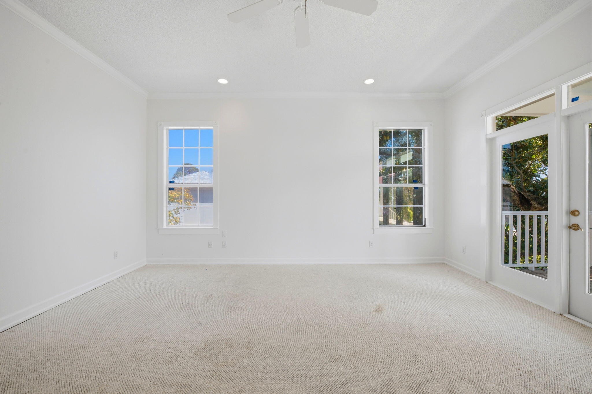 8127 Pompano Street Navarre, FL 32566 - Photo 16 of 44 an empty room with windows