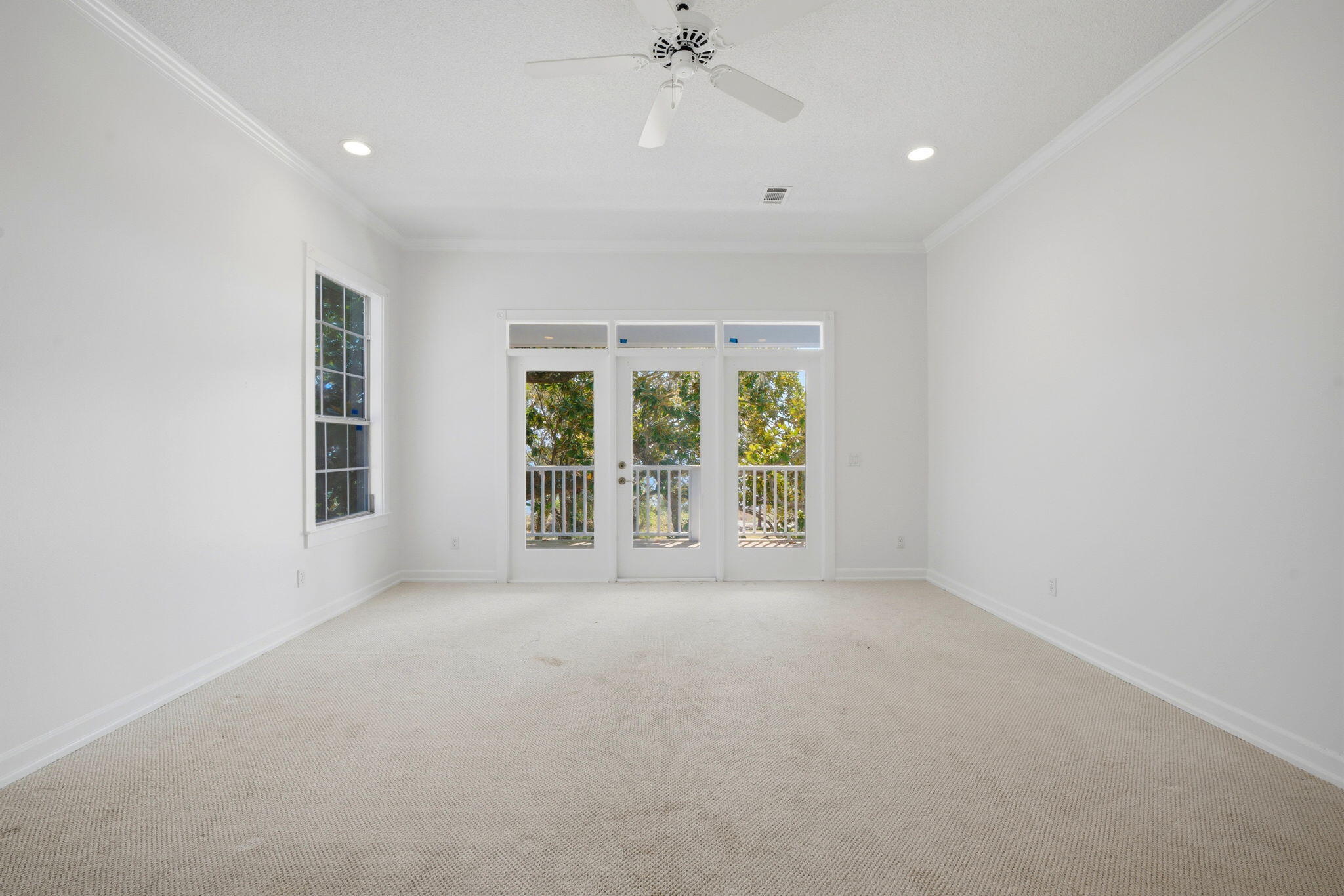 8127 Pompano Street Navarre, FL 32566 - Photo 17 of 44 an empty room with windows and view
