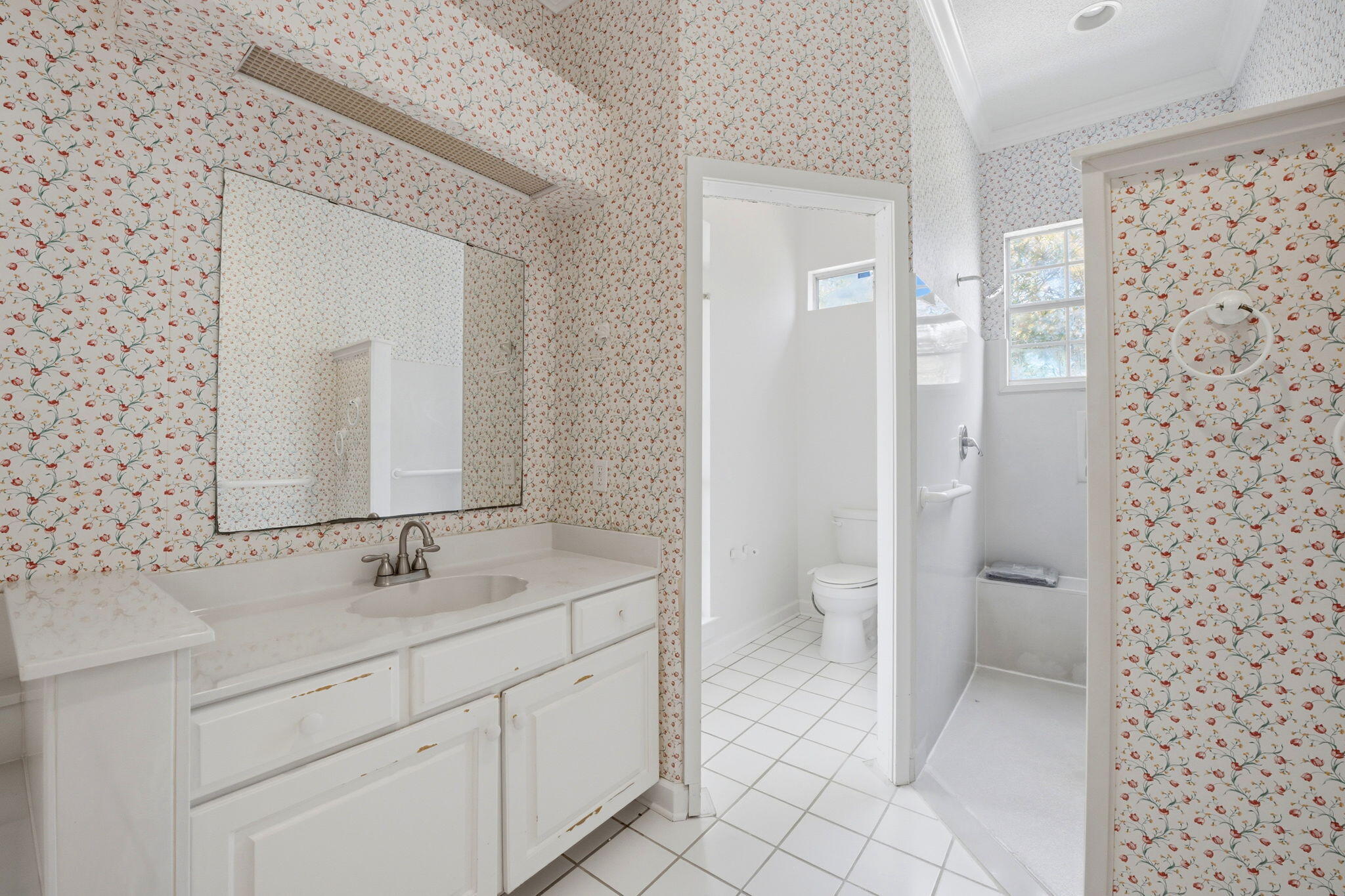8127 Pompano Street Navarre, FL 32566 - Photo 19 of 44 a bathroom with a double vanity sink mirror and toilet