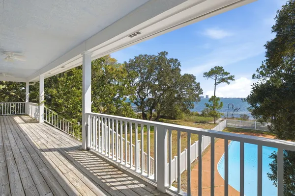 a view of a balcony with wooden floor