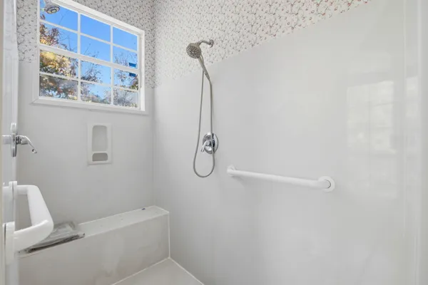 a bathroom with a bath tub and a shower