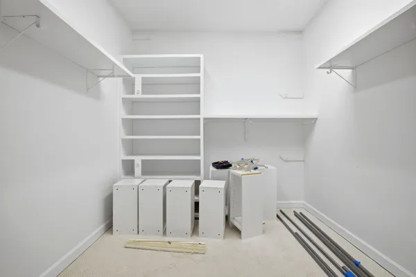 a view of water heater room with racks