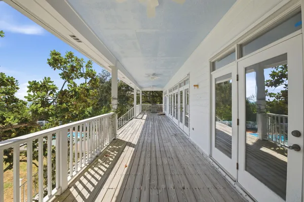 a view of balcony with wooden floor