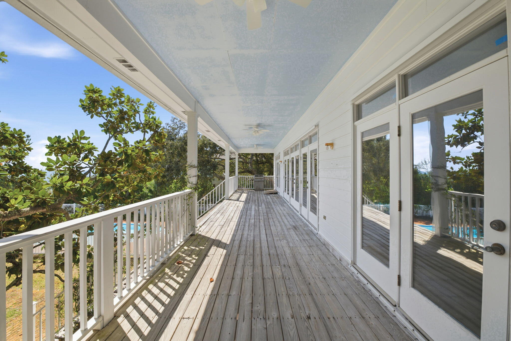 8127 Pompano Street Navarre, FL 32566 - Photo 26 of 44 a view of balcony with wooden floor