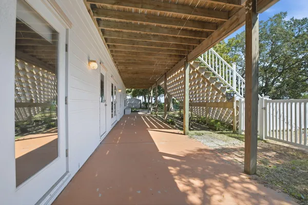 a porch with wooden floor and city view