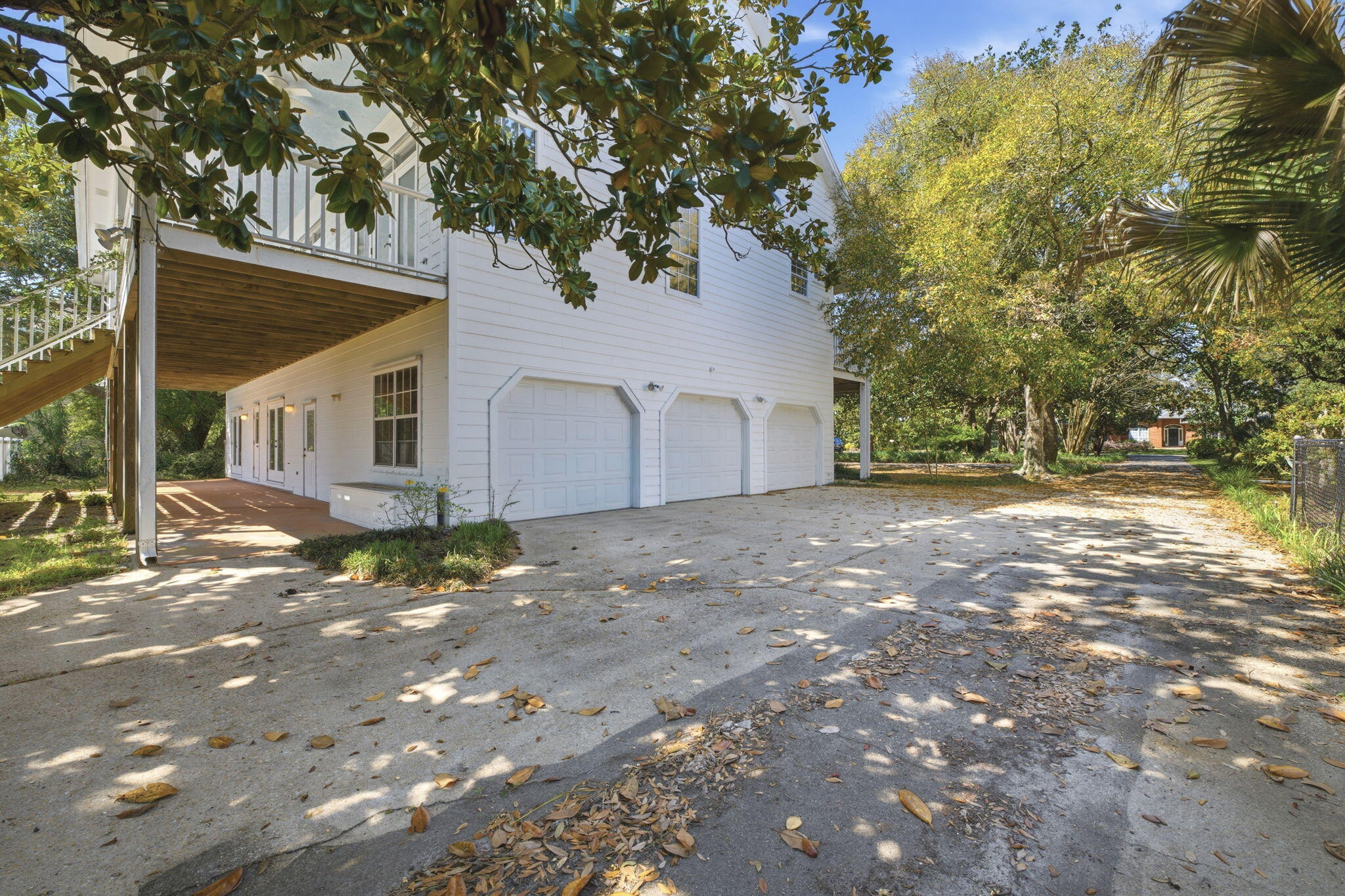 8127 Pompano Street Navarre, FL 32566 - Photo 29 of 44 a view of a house with a yard