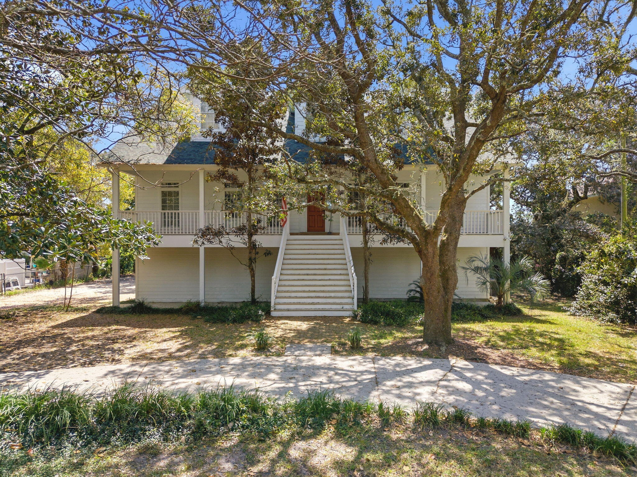 8127 Pompano Street Navarre, FL 32566 - Photo 3 of 44 a view of a house with a yard