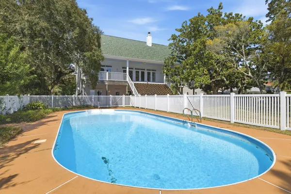 a view of a swimming pool with a patio