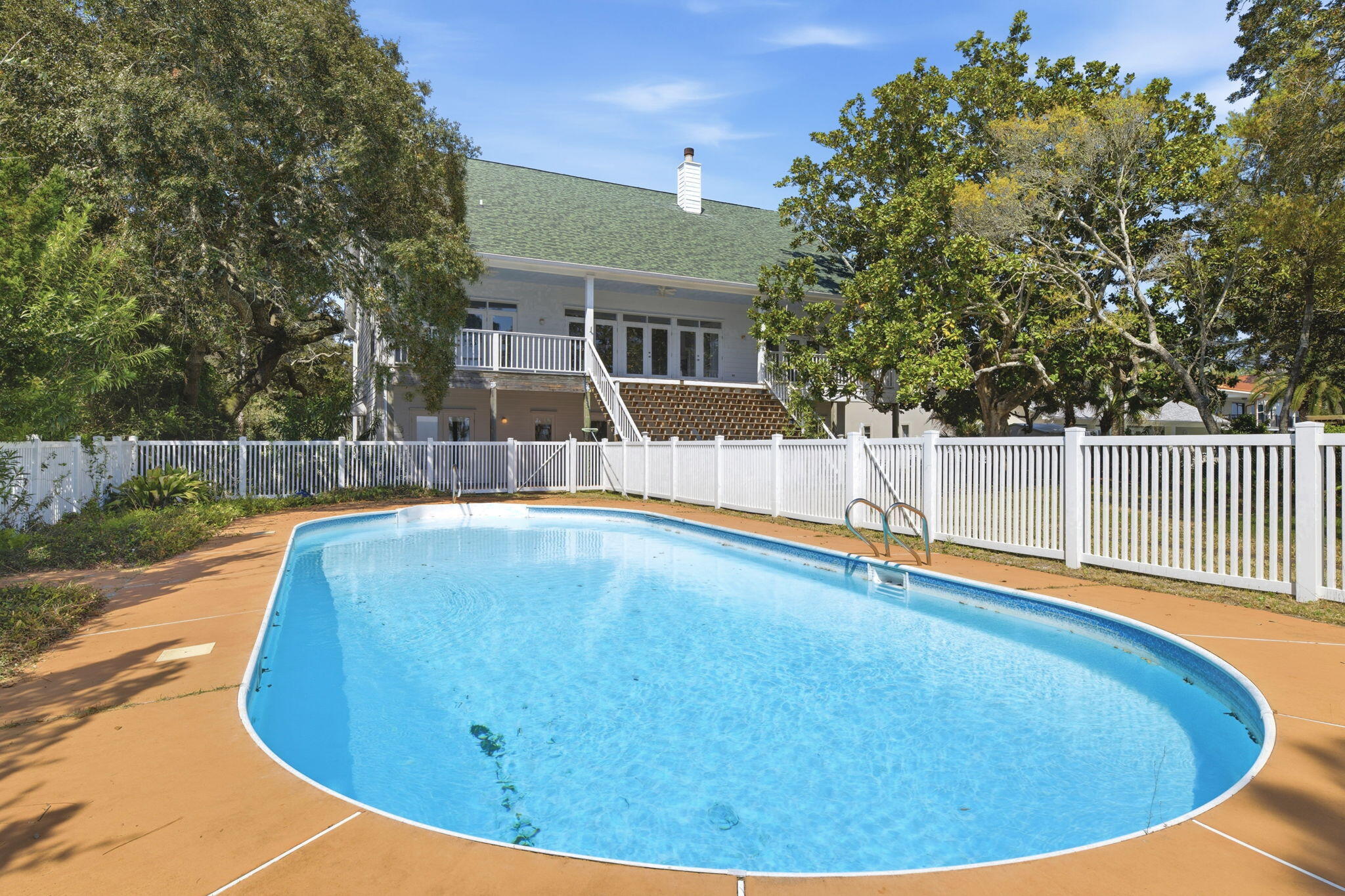 8127 Pompano Street Navarre, FL 32566 - Photo 32 of 44 a view of a swimming pool with a patio