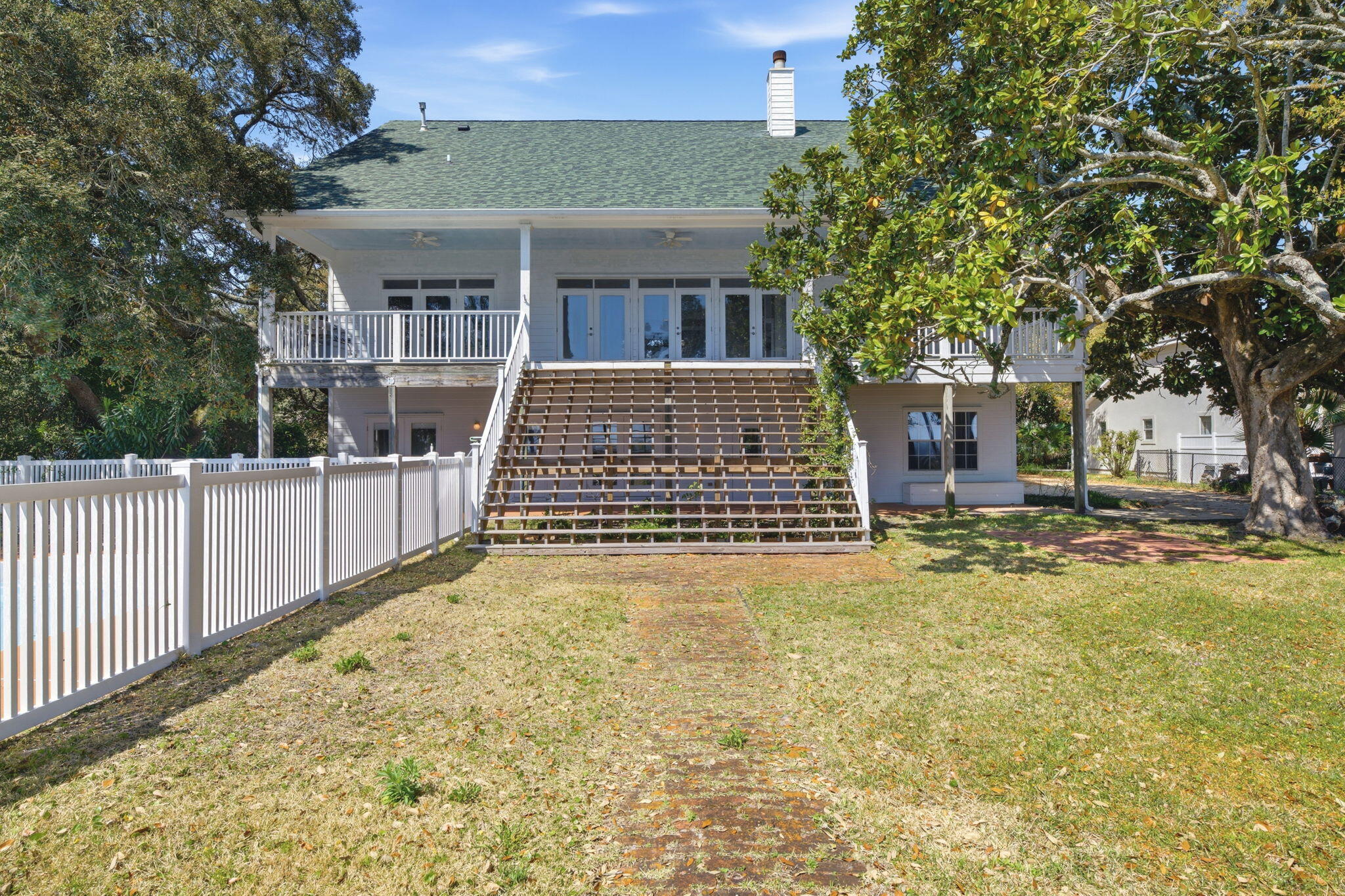 8127 Pompano Street Navarre, FL 32566 - Photo 33 of 44 a front view of a house with a yard