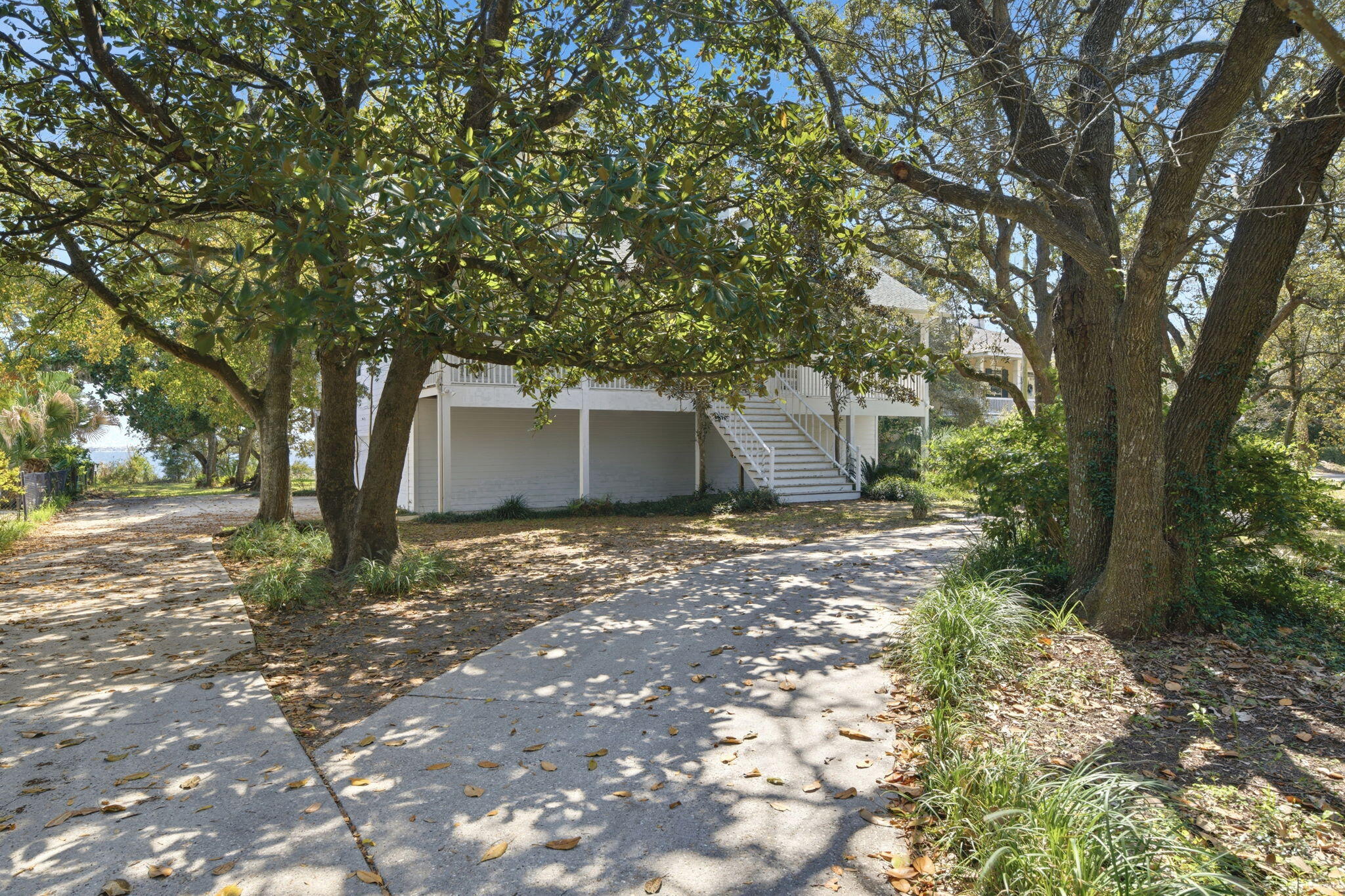 8127 Pompano Street Navarre, FL 32566 - Photo 35 of 44 a view of a house with a tree