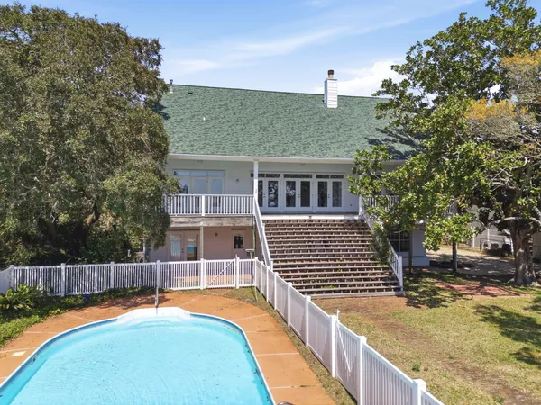 a view of a swimming pool with a lounge chairs