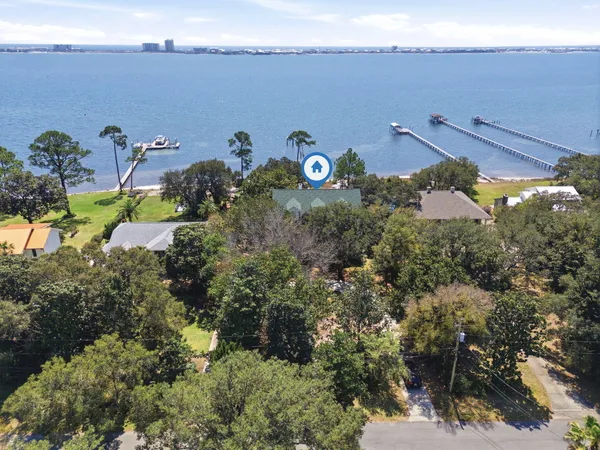 a view of a swimming pool with a yard