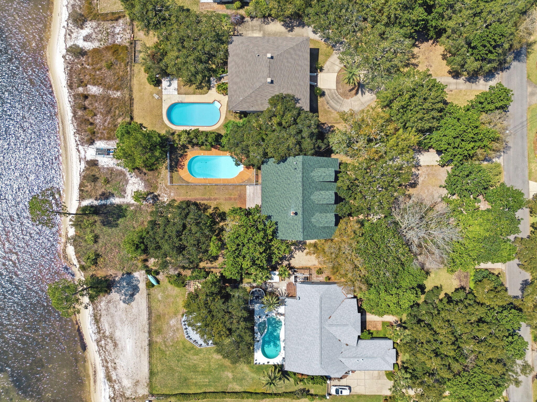 8127 Pompano Street Navarre, FL 32566 - Photo 44 of 44 an aerial view of a house with a yard and garden